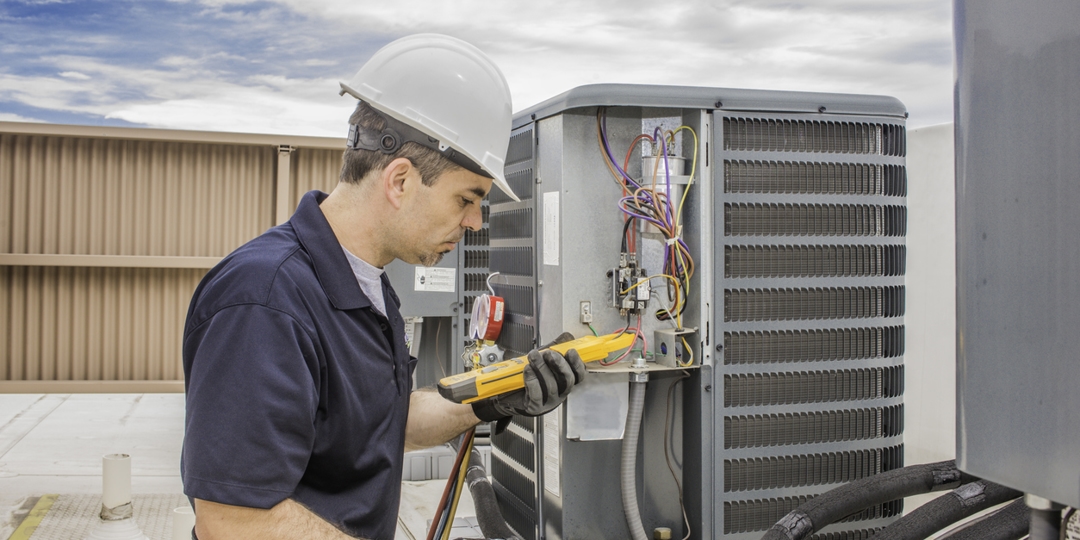 tech working on hvac unit