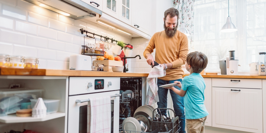 father and son doing dishes