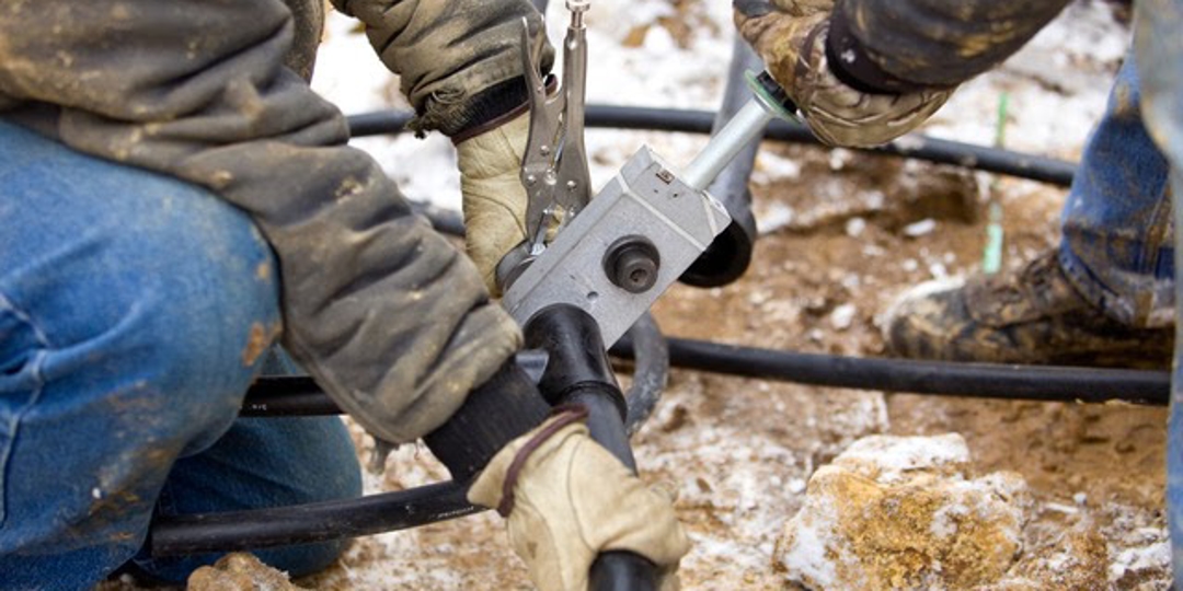technicians cutting cable