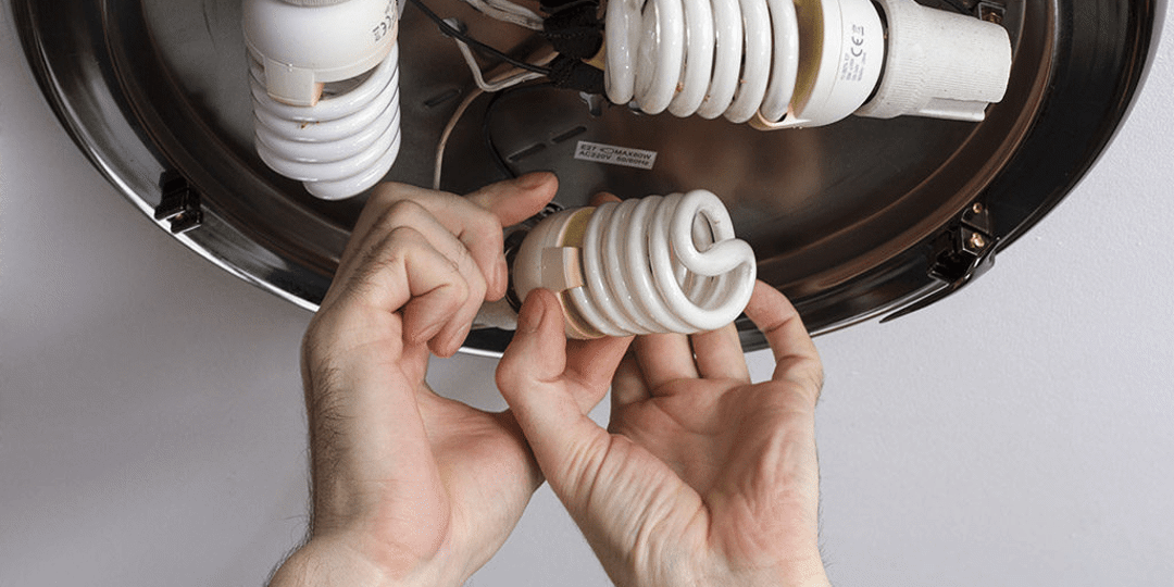 An image of new light bulbs being installed
