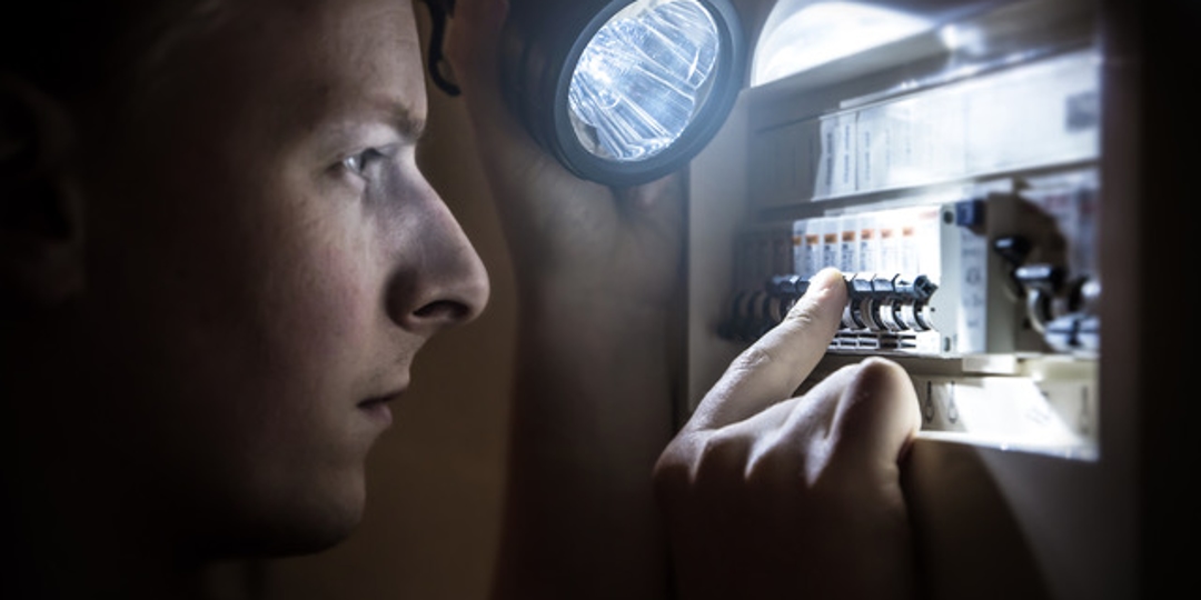 man with fuse box