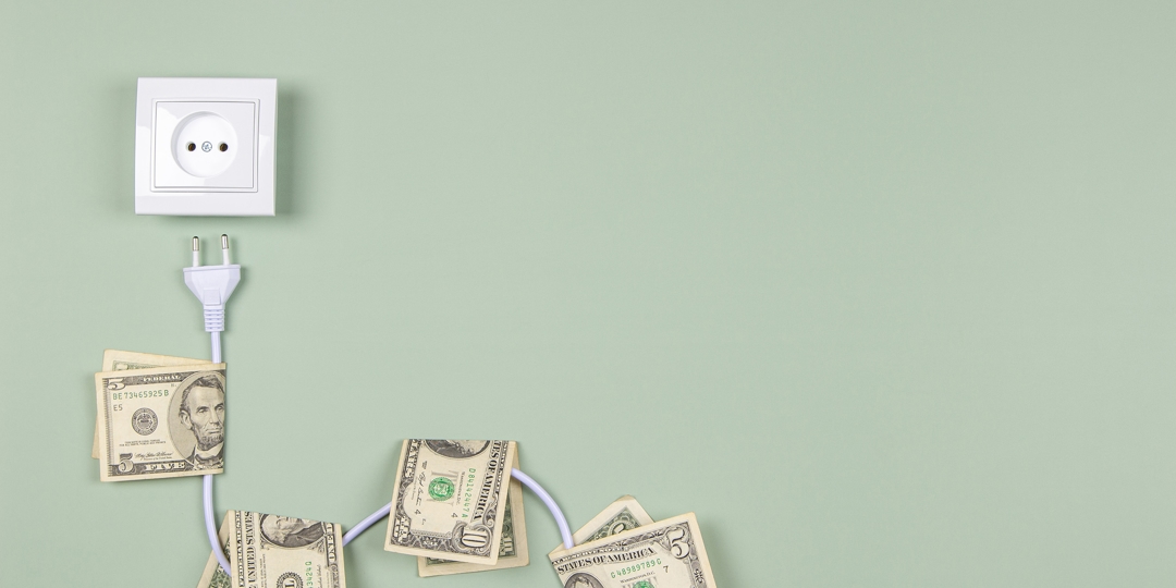 dollar bills atached to an electrical cord