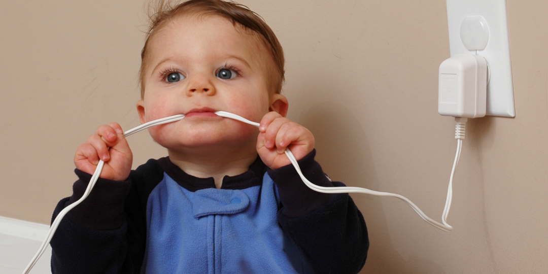 child chewing on electrical wire