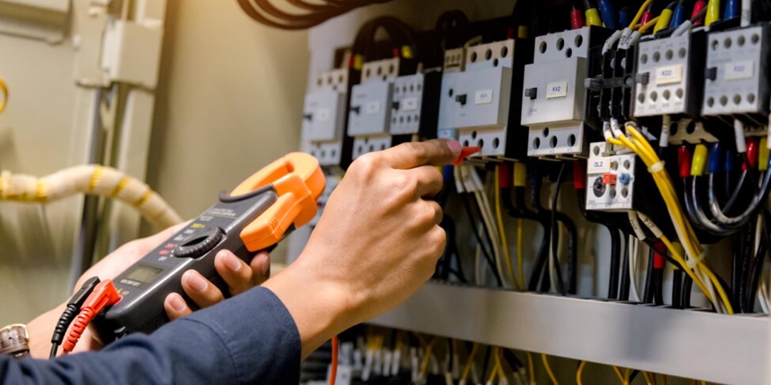 A photo of tech working on a circuit board
