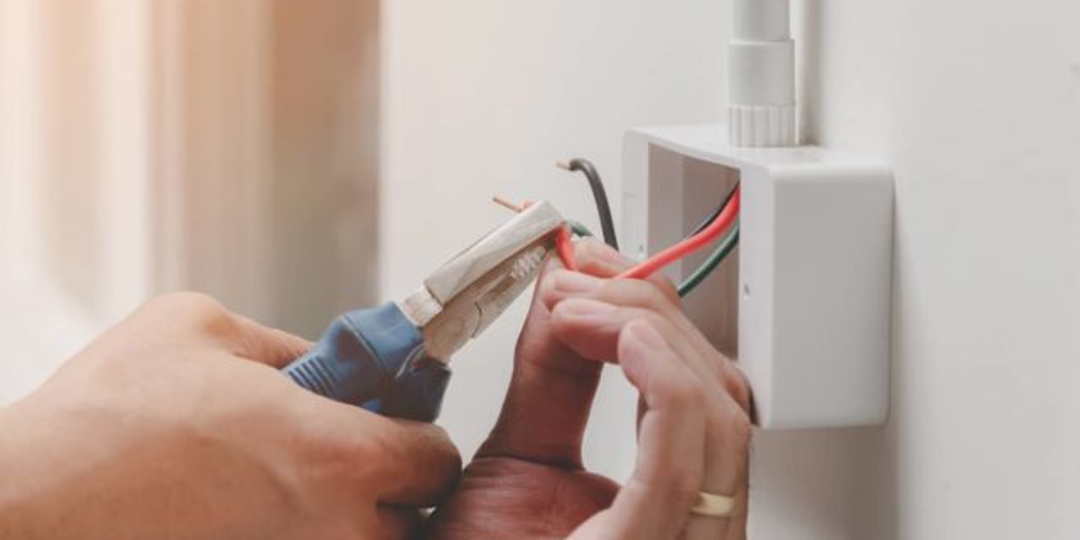 Man fixing wires