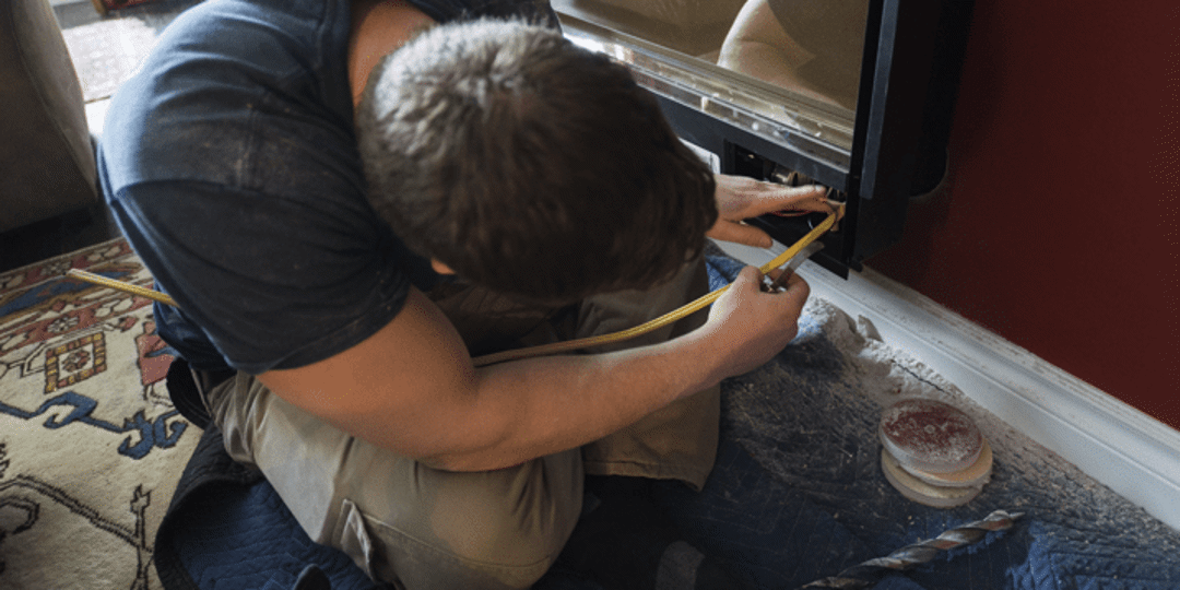 Man working on a fire place