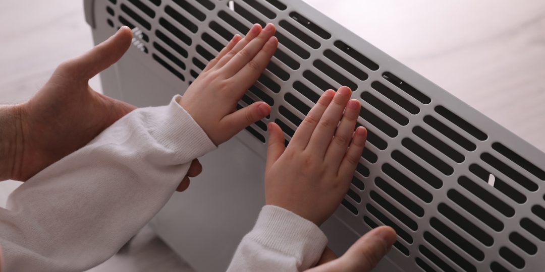 hands on a heater
