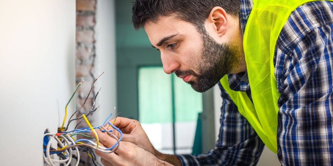 Electrician adjusting wires