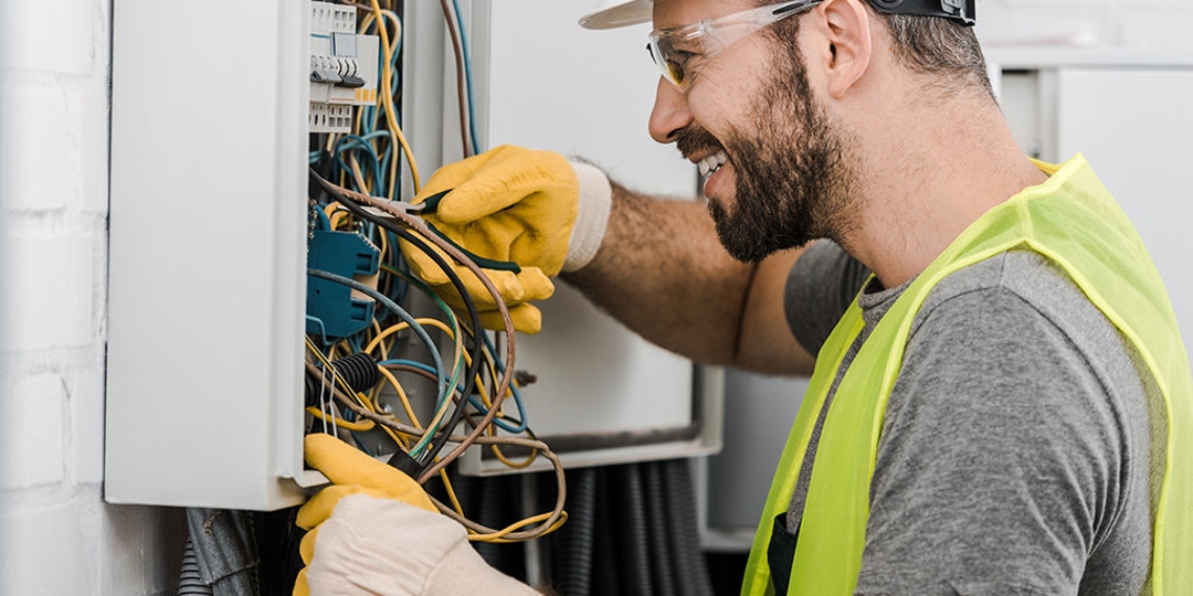 Electrician fixing electrical panel