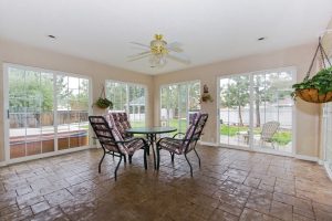 A picture of a room with a ceiling fan